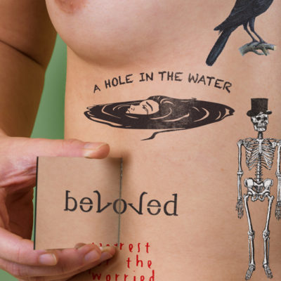 Amigram tattoo reading "Beloved"